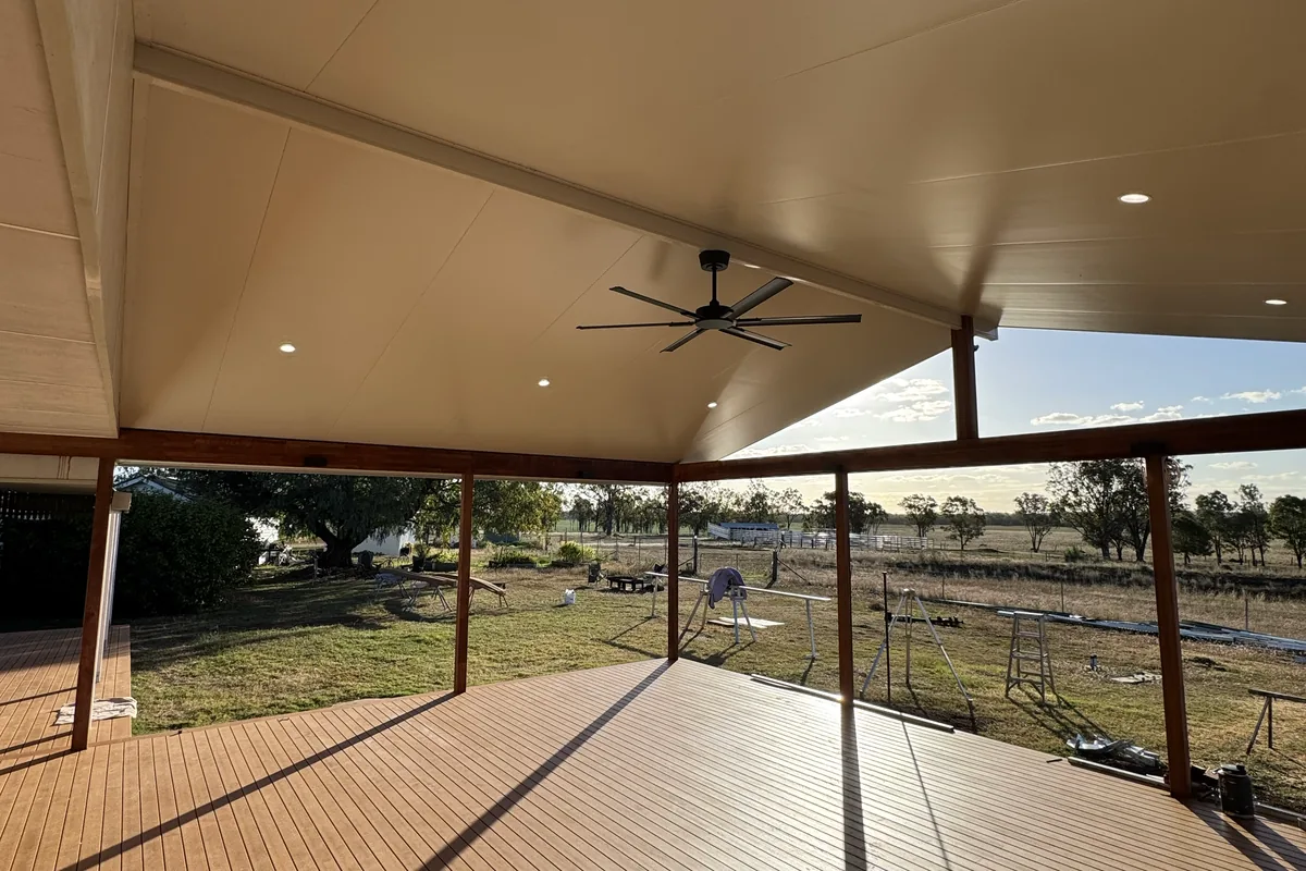 Ceiling fans and downlights fitted in a covered outdoor area